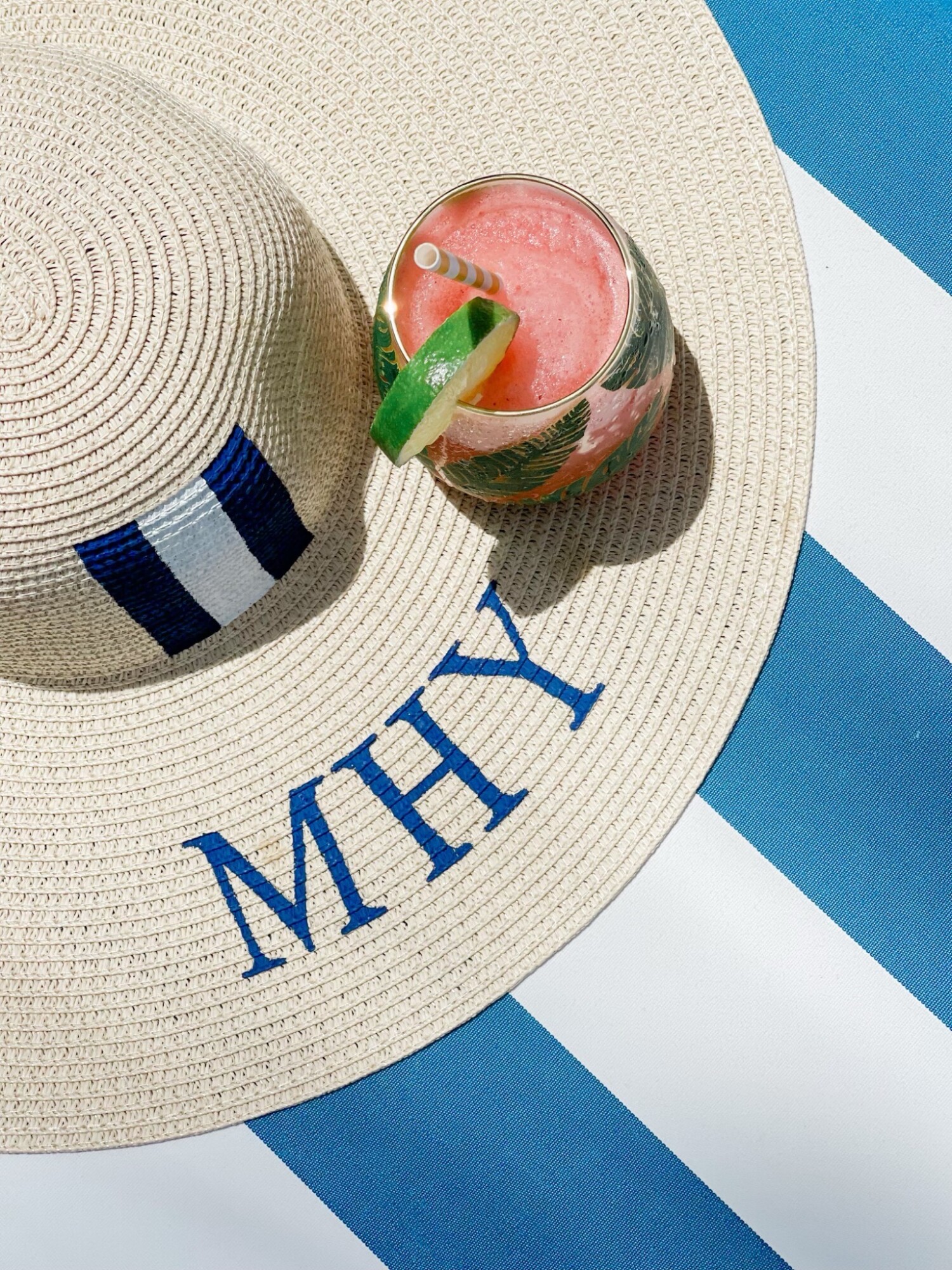 Monogrammed beach hat with a cocktail